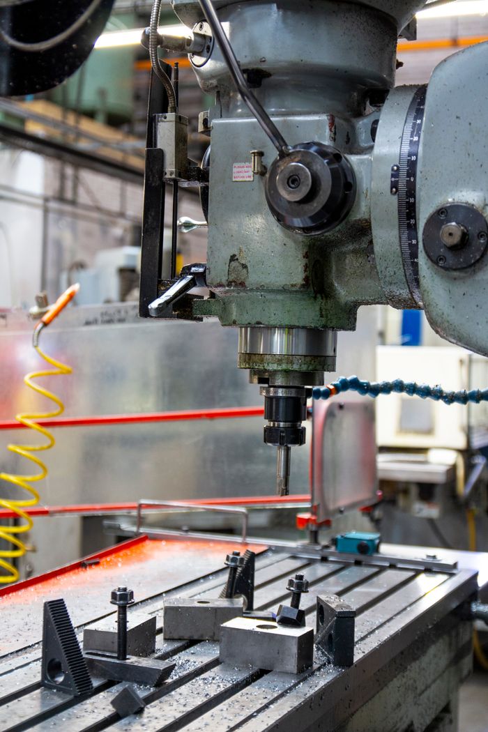 home-hero Close-up of a lathe machine in a workshop setting, showcasing precision engineering.