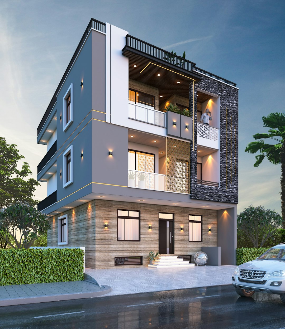 about-02 The image depicts a modern three-story house with a contemporary design. The exterior is primarily white with gray accents and features large windows that offer ample natural light. A balcony extends from the second floor, providing an outdoor space. The house is surrounded by lush greenery and palm trees, creating a serene atmosphere. contact us now for house map and designing work ???? www.nakshabanwao.com ???? +91-9549494050