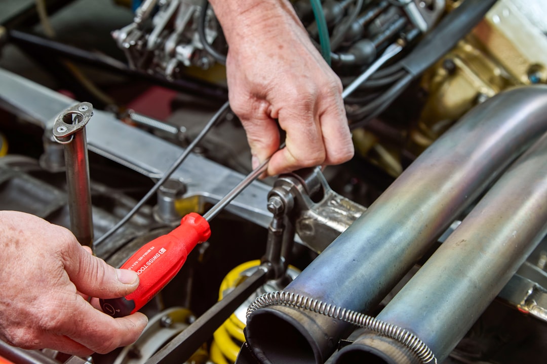 services-img mechanic-working-on-car-engine-with-tools-i6pqshymjow