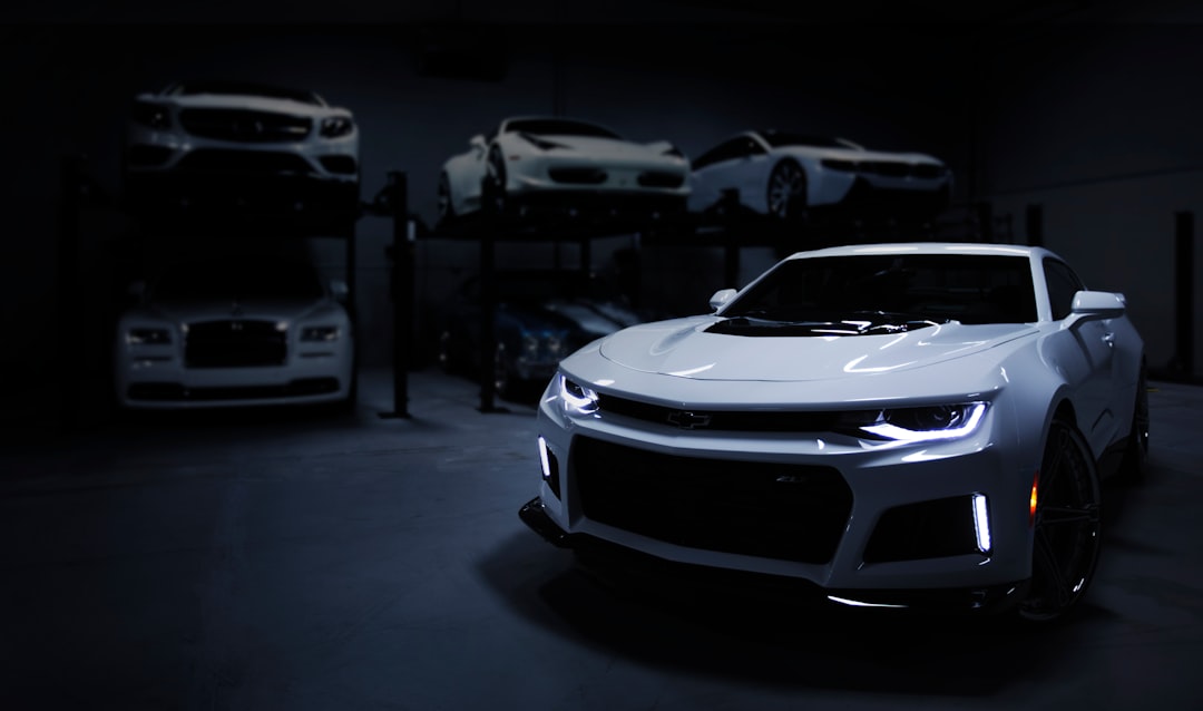 services-01 I shot this while doing a job for a luxury automotive storage facility in Baltimore, MD. I wanted to create an ominous sense of intrigue, giving the feeling of a space that was both expansive and enclosed. I enjoy the journey my eyes take from the focal point of the headlamps to the contours of the Camero’s body, and then to the backdrop of stacked automobiles.